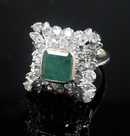 A 19th century style white gold, emerald and diamond cluster ring, size K.